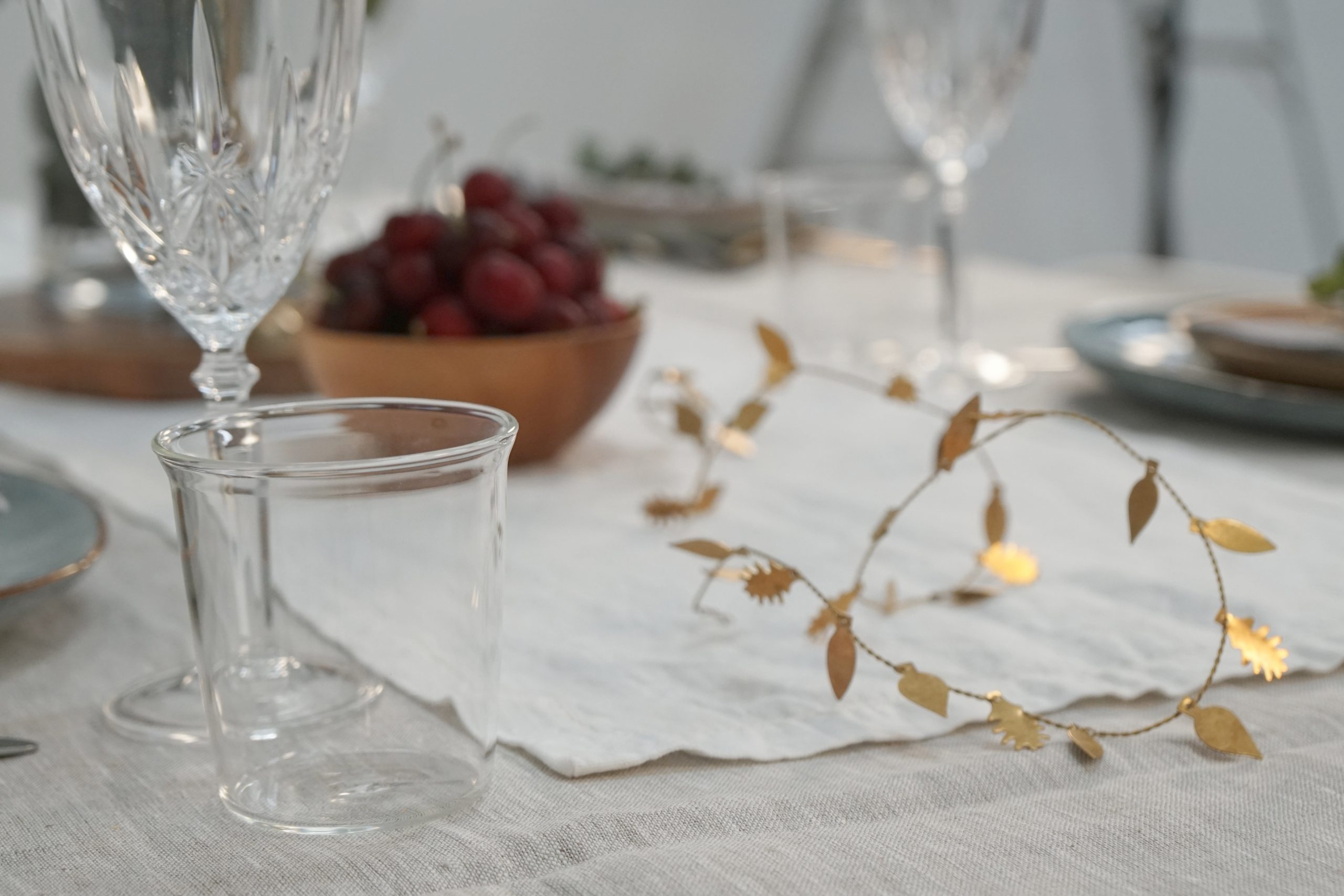 Brass wire Christmas garland on table 